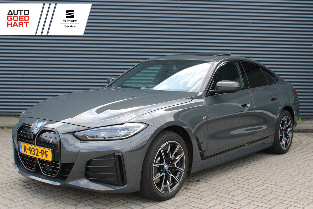 BMW i4 eDrive40 84 kWh M-Sport SOH-100% Dravitgrau Schuif-/kanteldak Leer Harman-Kardon Camera