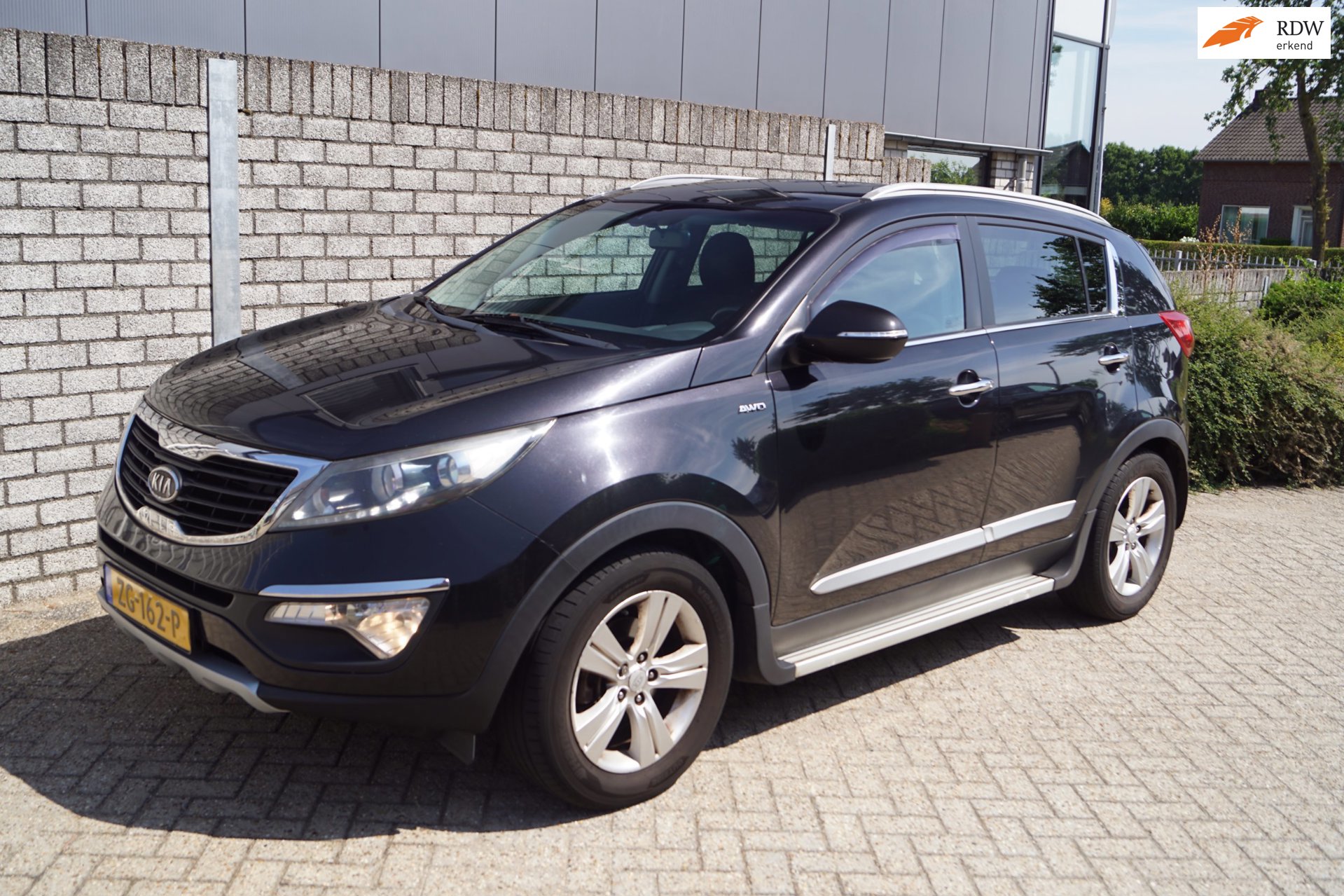 Kia Sportage 2.0 Plus Pack AWD Autom Sportst Stoelverw A Bankverw Clima Cruise PDC LMV Trekhaak ENZ.