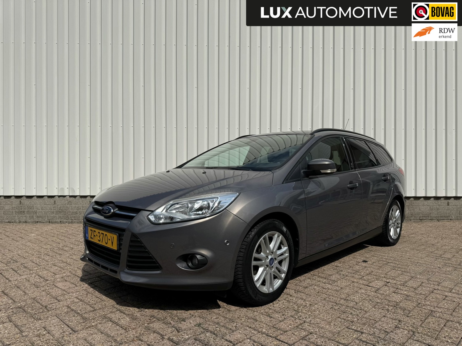 Ford Focus Wagon 1.6 EcoBoost Lease Titanium, Trekhaak 1.500kg, 4 seizoenenbanden, PDC