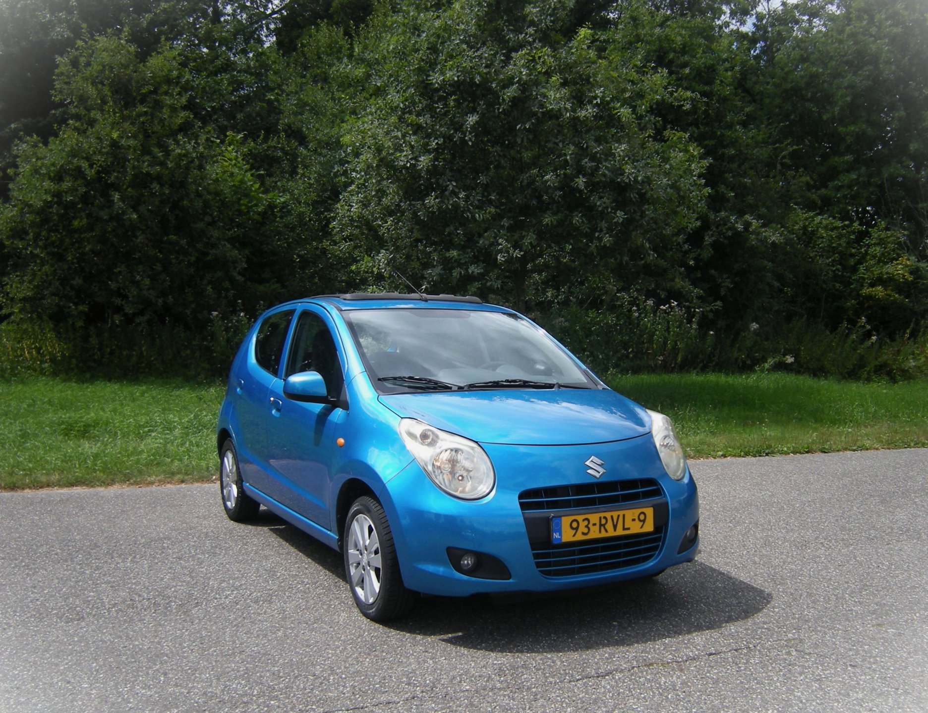 Suzuki Alto 1.0 Exclusive . 5 Drs . Airco . SCHUIF / Cabrio dak . uniek ...LMV . enz
